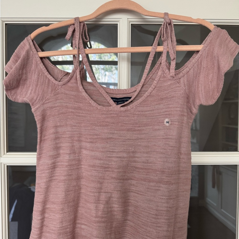 New American Eagle dusty rose top with strappy details and off the shoulder.